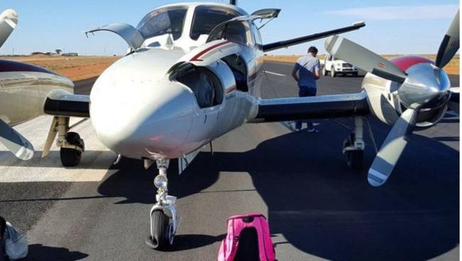 The plane, with its front flat tyre at Cooper Pedy airport. Instagram photo taken by swimmer Cate Campbell.