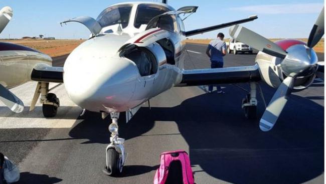 The plane, with its front flat tyre at Cooper Pedy airport. Instagram photo taken by swimmer Cate Campbell.