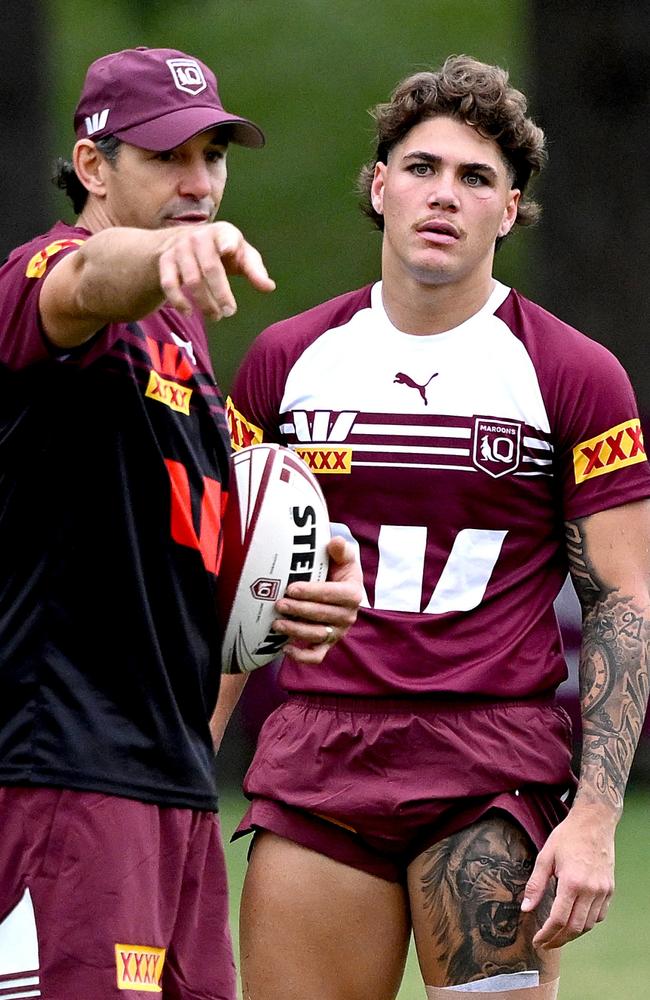 Coach Billy Slater talk tactics with Reece Walsh during a Queensland Maroons State of Origin training session in May. Picture: Bradley Kanaris/Getty Images