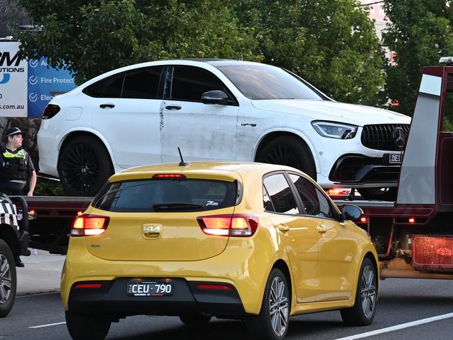 A white Mercedes is towed from the scene. Picture: Josie Hayden