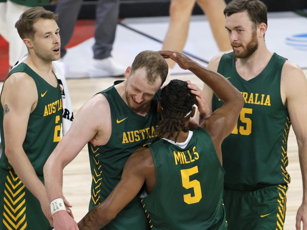 Joe Ingles and Patty Mills hug after Mills hit a three-pointer against Argentina in a warm-up game in Las Vegas earlier this month. Picture: AFP