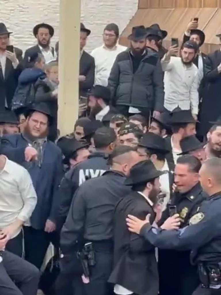 The group of young Orthodox Jewish men clamoured to get inside the tunnel to prevent crews from filling it with cement. @FrumTikTok / X