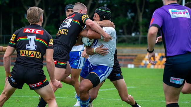 David Leota cops a high shot from the defence. Picture: Thomas Lisson.