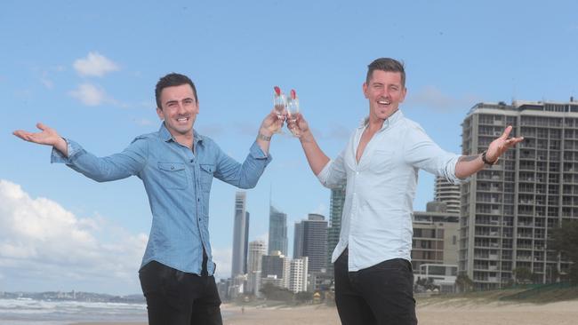 Same-sex couple Matt Stephan and Jeremy Edwards (left) at Main Beach celebrating the result of the yes vote. Photo: Richard Gosling