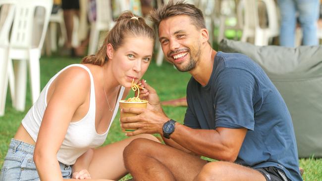 Kayla Spicer and Ryno Neser on their first anniversary at the same event and same spot as their first date at the 2022 Laksa Festival. Picture: Glenn Campbell