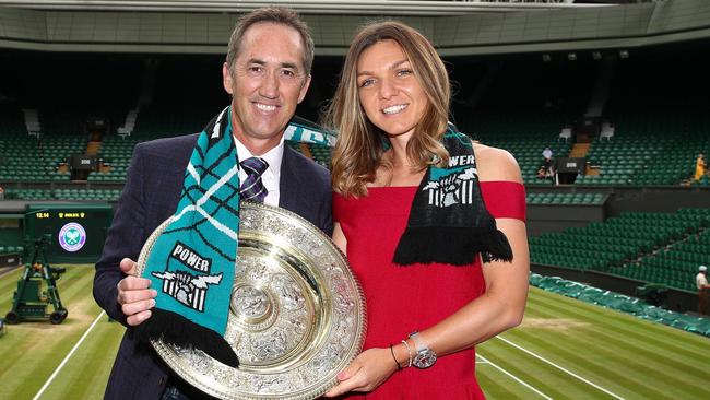 Simona Halep and coach Darren Cahill with the Wimbledon trophy. Picture: Port Adelaide FC/Twitter