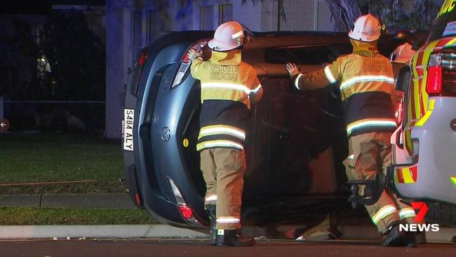 MFS crews were called to cut the driver from her car after she hit a Stobie pole and rolled at Novar Gardens. Picture: 7NEWS