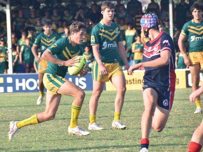 St Brendan’s College captain Tommy Green makes a break in the Open A grand final.