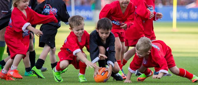 Auskick players keeping the crowd entertained at half time of the Melbourne vs Gold Coast Suns game in Alice Springs. Photo: EMMA MURRAY