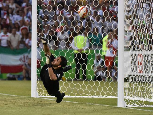 Iran goalkeeper Alireza Haghighi couldn’t prevent his side losing to Iraq.