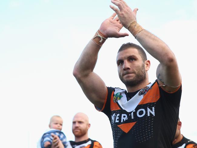 SYDNEY, AUSTRALIA - AUGUST 30: Robbie Farah of the Wests Tigers applauds the crowd after the Tigers last home game of the season during the round 25 NRL match between the Wests Tigers and the New Zealand Warriors at Campbelltown Sports Stadium on August 30, 2015 in Sydney, Australia. (Photo by Mark Kolbe/Getty Images)