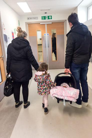 MERCURY PRESS. 09.04.18. Falkirk, UK. (Pictured: Kirsti Clark, 28, Malena Clark, 3, Harper Clark, 3 weeks and Christopher Clark, 29, leaving hospital after the birth of Harper.) A mum has issued a stark warning after her newborn was left foaming at the mouth and stopped breathing when a two-hour journey in a car seat caused oxygen deprivation.Kirsti Clark, 28, and her husband Christopher Clark, 29, spent a day out with their daughters on April 4 - taking three-week-old Harper Clark out of her car seat every time they stopped at a shop.A long journey home due to rush-hour traffic didnt worry the parents of two but when they got in and laid Harper on her play mat the babys lips turned blue, her jaw clenched shut and white foam started frothing out her nose and mouth.(SEE MERCURY COPY)