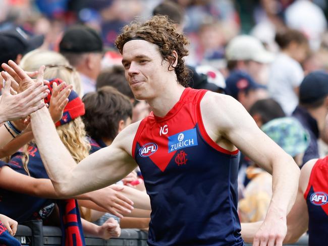 MELBOURNE, AUSTRALIA - MARCH 17: Ben Brown of the Demons celebrates a win with fans during the 2024 AFL Round 01 match between the Melbourne Demons and the Western Bulldogs at the Melbourne Cricket Ground on March 17, 2024 in Melbourne, Australia. (Photo by Dylan Burns/AFL Photos via Getty Images)