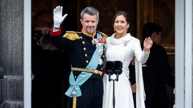 King Frederik X of Denmark and Queen Mary of Denmark wave on the balcony of Christiansborg Palace after a declaration on the accession to the throne.