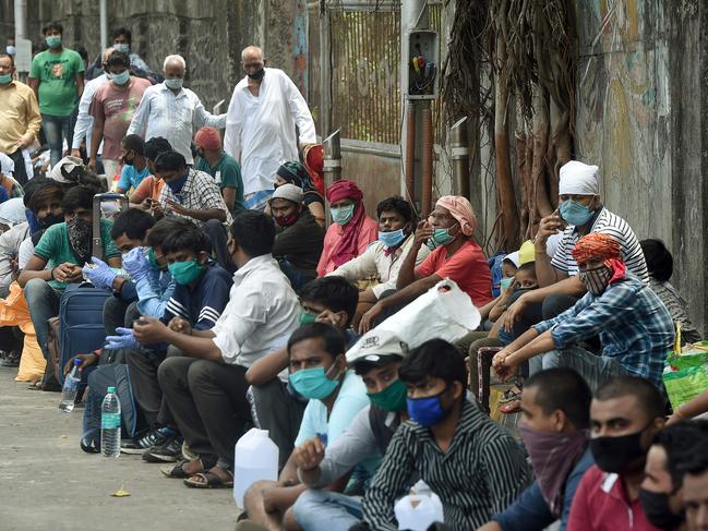 Migrant workers wait to return to their hometowns after the government eased a nationwide lockdown as a preventive measure against coronavirus in India but infections are on the rise. Picture: AFP