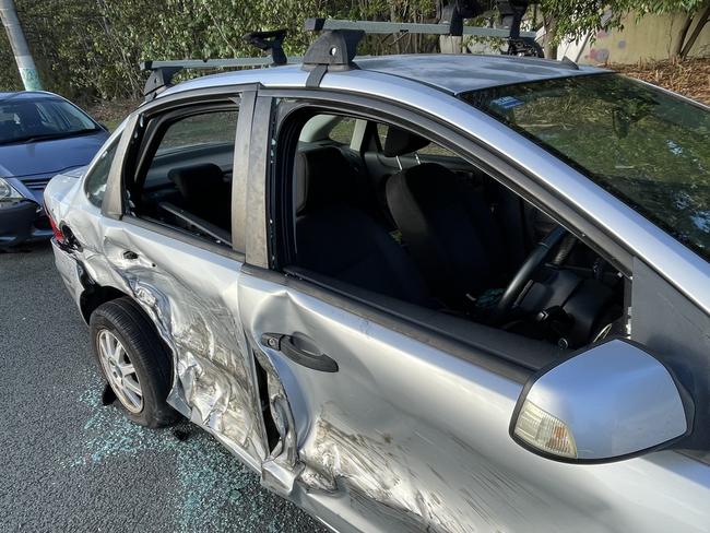 Driver hospitalised after slamming into three parked cars at Runaway Bay.