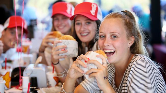 Customers (left to right) Tahlia Eaton, Sarah Madden, and Taelah Goodman tuck in. Picture: Troy Snook