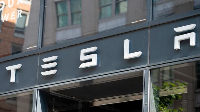 (FILES) In this file photo taken on August 08, 2018, the Tesla logo is seen outside of their showroom in Washington, DC. Picture: Saul Loeb