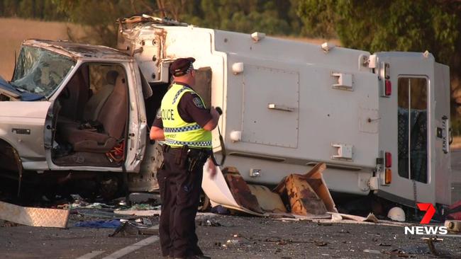 Police at the scene of the collision on Victor Harbor Road, near Bambrick Road. Picture: 7NEWS