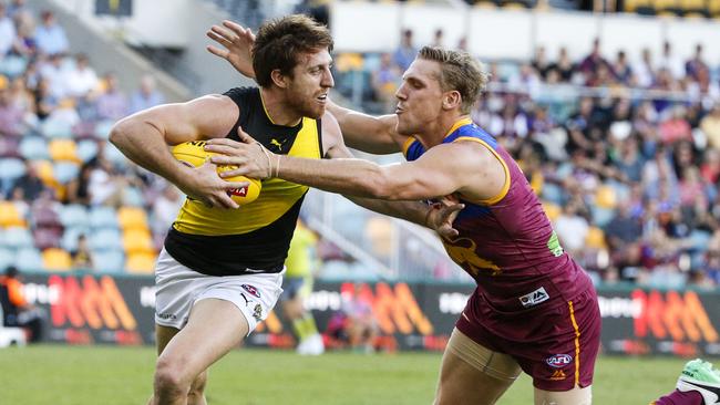 Reece Conca shrugs off Tom Bell. Picture: AAP