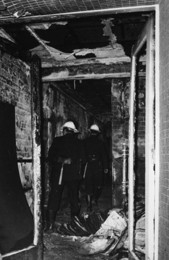 Firemen inspect charred remains of the Savoy Hotel, Kings Cross, on Christmas Day, 1975. Picture: News Limited