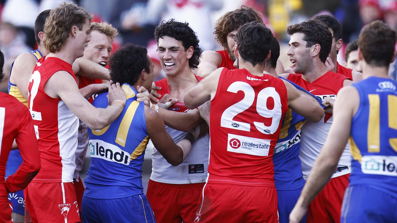 Players from both sides wrestle at GMHBA Stadium. Picture: Daniel Pockett