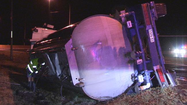 TURNED OVER: Truck rollover on the Cunningham Highway Sunday night.