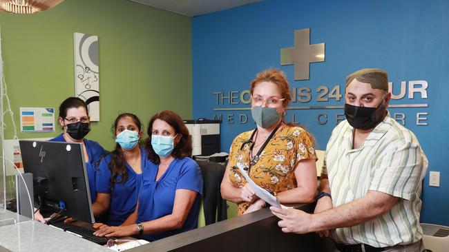 Cairns 24 hour Medical Centre assistant manager Celia Zarins, team leader Jyoti Loomba, receptionist Stacie Boccalatte and doctors Lana Anderson and Romies Usman have all been taking on extra hours to deal with the increased workload at the clinic. Picture: Brendan Radke