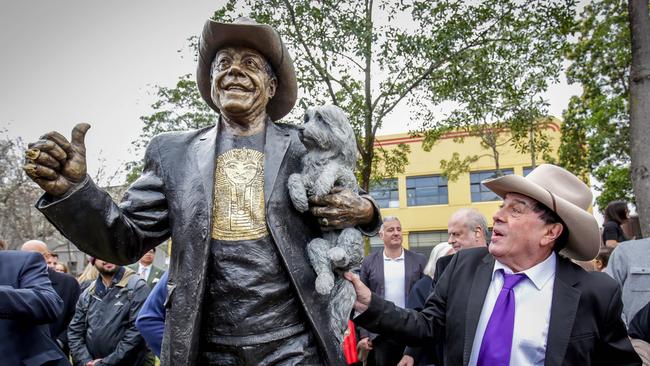 Ian “Molly” Meldrum stands with the larger-than-life bronze statue of himself and his adored dog, Ziggy. Picture: Nicole Cleary