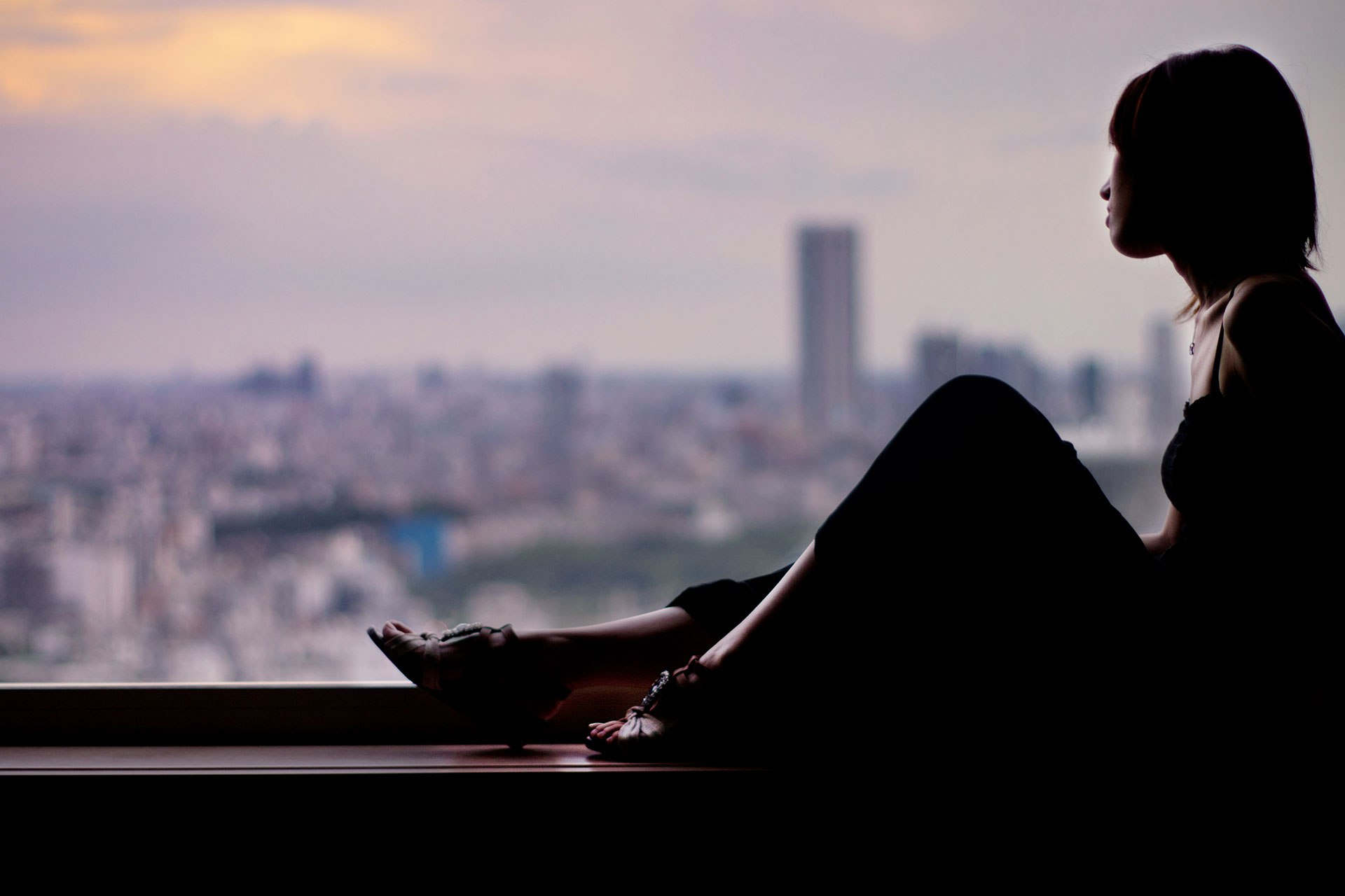 Quite alone. Woman on a Ledge.