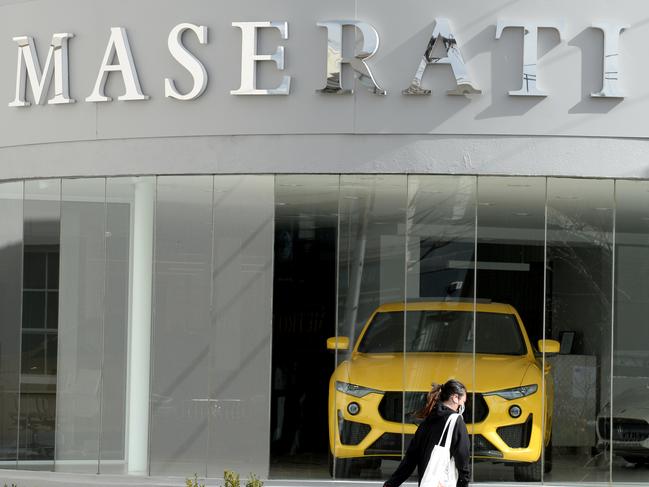 MELBOURNE, AUSTRALIA - NewsWire Photos SEPTEMBER 3, 2020: A woman walks past a Maserati car showroom on Swan Street Richmond. Picture: NCA NewsWire / Andrew Henshaw