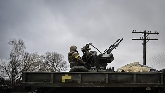 A Ukrainian soldier mans an anti-aircraft gun northeast of Kyiv. Russia’s forces have been exposed as less powerful than the West imagined. Picture: AFP