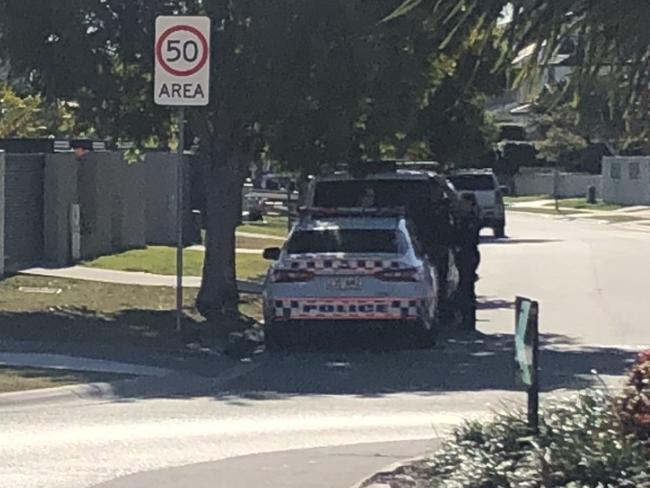 Police vehicles at the scene.