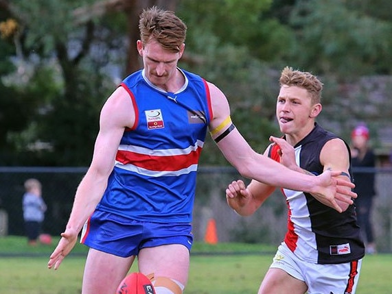 A regular sight in the EFL: Chris Jones clearing the ball from defence. Picture: Eastern Sporting Images