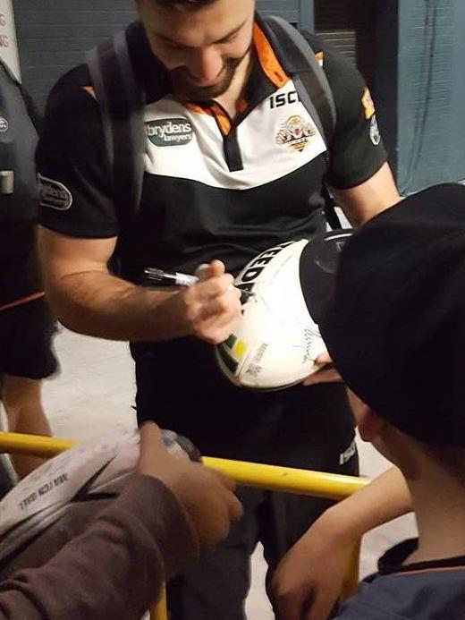 James Tedesco with young fan Ashton