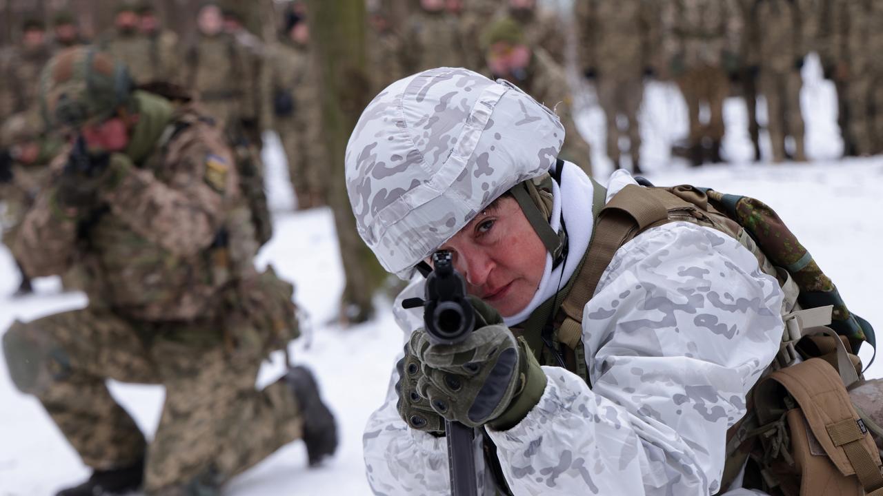 KYIV, UKRAINE – JANUARY 22: Mariana, 52, a marketing researcher who for the past two years has been a volunteer in a Kiev Territorial Defence unit, trains on a Saturday in a forest on January 22, 2022 in Kiev, Ukraine. Across Ukraine thousands of civilians are participating in such groups to receive basic combat training and in time of war would be under direct command of the Ukrainian military. While Ukrainian officials have acknowledged the country has little chance to fend off a full Russian invasion, Russian occupation troops would likely face a deep-rooted, decentralised and prolonged insurgency. Russia has amassed tens of thousands of troops on its border to Ukraine. (Photo by Sean Gallup/Getty Images)