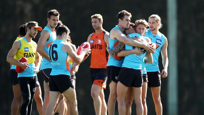 Giants Jeremy Cameron, Tim Taranto and Lachie Whitfield interact during a Greater Western Sydney training session at WestConnex Centre in Sydney.