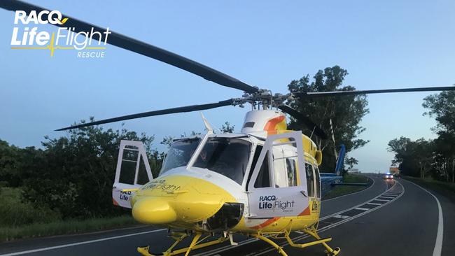 The Bruce Highway, south of Gympie, played as a makeshift landing pad for the rescue chopper, which was sent to scene just after 6pm last night. Photo: LifeFlight