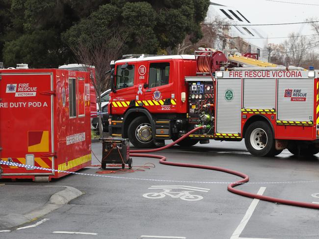 MELBOURNE, AUSTRALIA - NewsWire Photos, AUGUST 17, 2021. Police and fire fighters at the scene where following the arrest of a man following a fire at a service station in Fitzroy overnight: NCA NewsWire / David Crosling