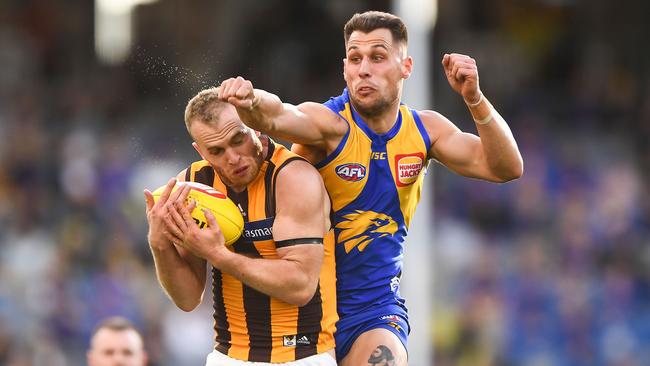 West Coast’s Nic Reid attempts to spoil Hawthorn’s Tom Mitchell on Sunday. Picture: Daniel Carson/AFL Photos via Getty Images