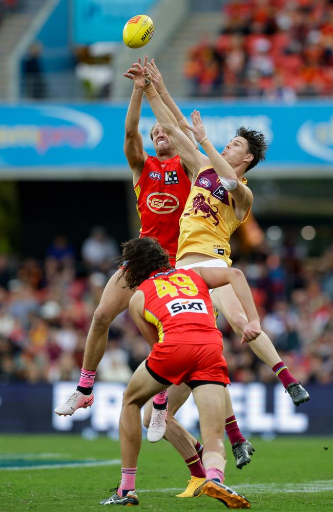 Jack Lukosius and Eric Hipwood compete in the air during the QClash. Picture: Russell Freeman/AFL Photos via Getty Images.