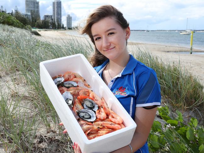 Chelsea Norgrove with king prawns and oysters at Harbour Seafood Market, Labrador. Picture: Liam Kidston