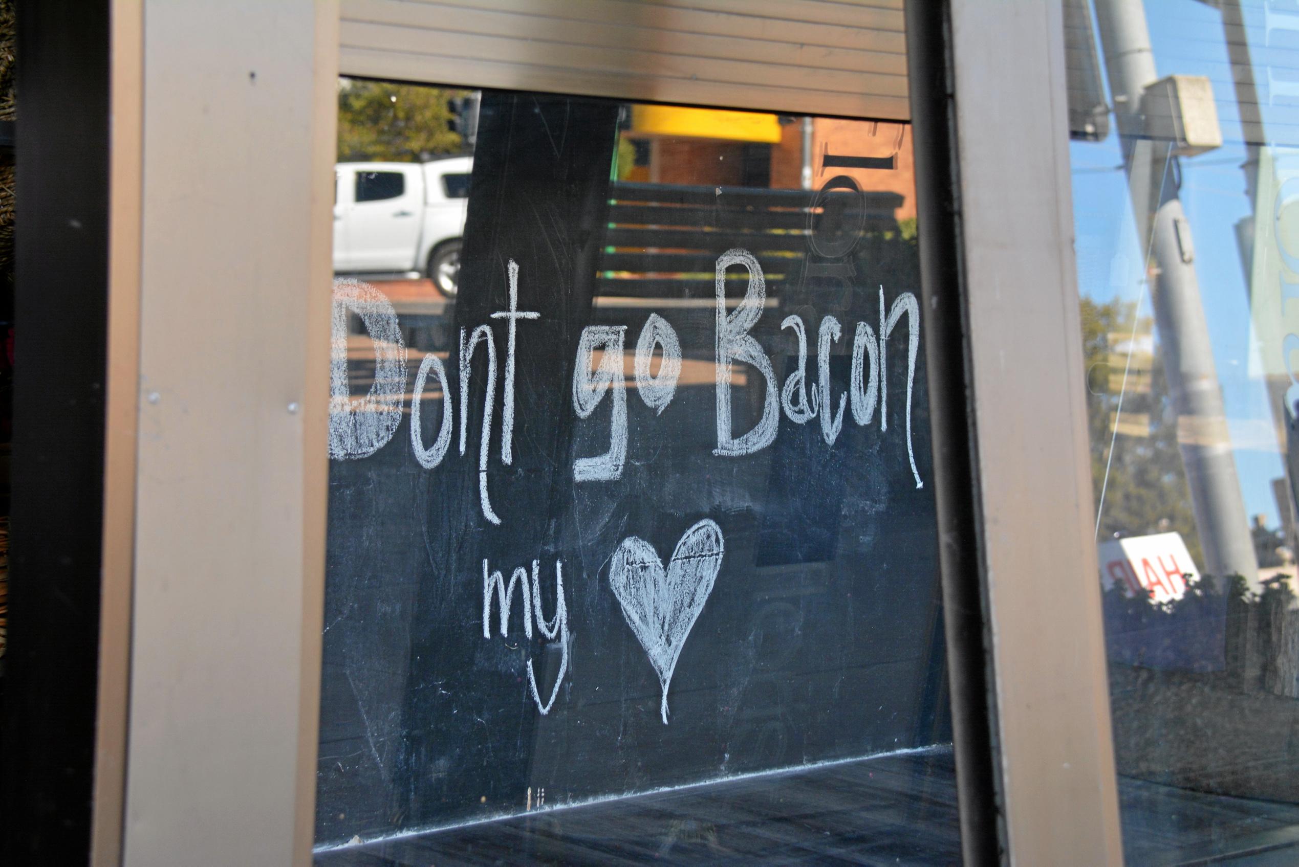 Haly St florist is prepared to assist with all matters of the heart... including a love of bacon by getting into the BaconFest Street Window Competition. Picture: Jessica McGrath