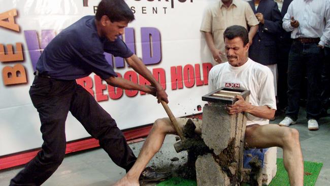 Real-life journalist Bibhuti Bhushan Nayak gets hammered for an Indian TV program. Picture: Reuters