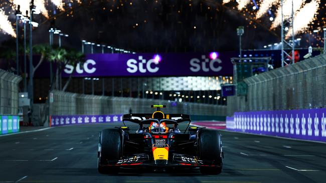 Race winner Sergio Perez of Mexico driving the (11) Oracle Red Bull Racing RB19 stops in parc ferme during the F1 Grand Prix of Saudi Arabia at Jeddah Corniche Circuit on March 19, 2023 in Jeddah, Saudi Arabia. (Photo by Mark Thompson/Getty Images)