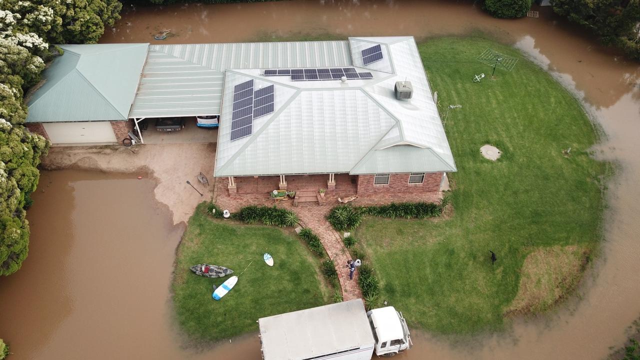 An aerial shot of Gary Tomlinson's home, as floodwaters inch closer to the Forbes property. Picture: Aymon Bertah