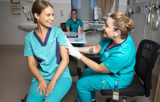 Registered nurse Zoe Park has become the first person in Queensland to receive the vaccine. Picture: NCA NewsWire/ Steve Holland