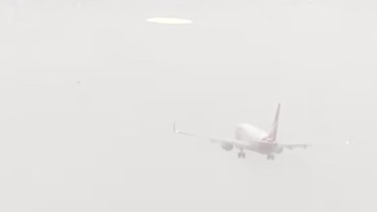 A Qantas plane aborts its landing at Hamilton Island after heavy rain.