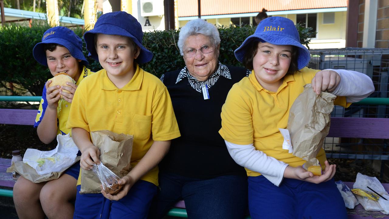 Rita Langer celebrating her 40th year volunteering in the Blair State School tuckshop, with students Isaac Jordan, Teejay Freeman and Jorja Tracey. Photo: Rob Williams / The Queensland Times