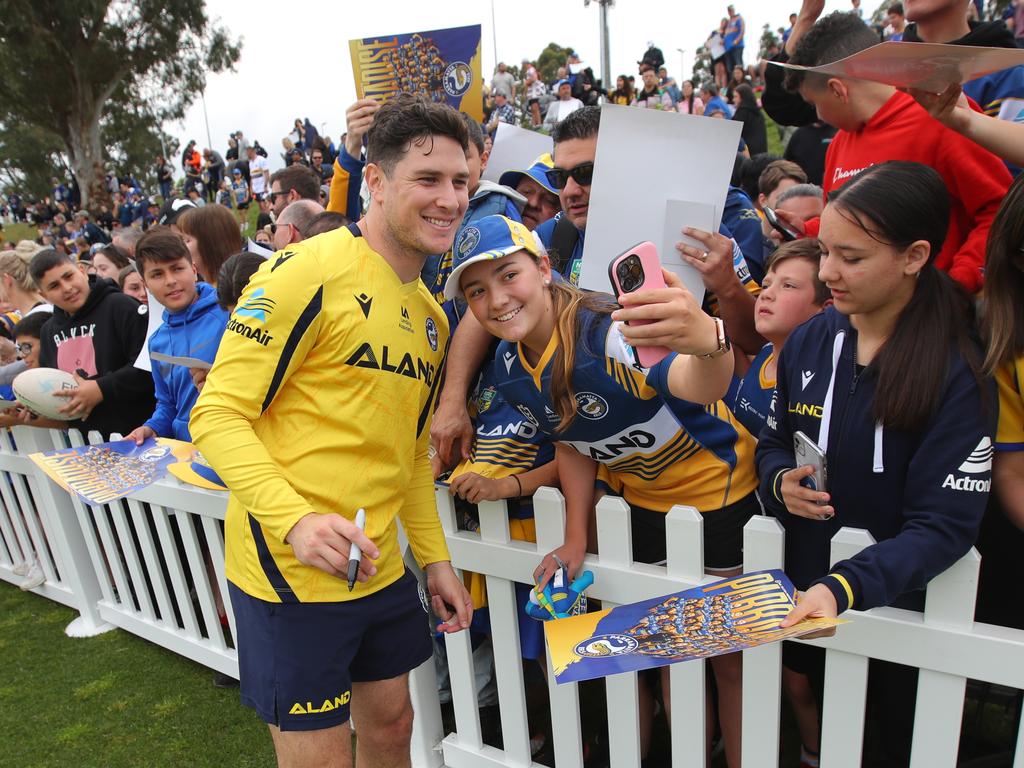 Parramatta Eels player Mitchell Moses poses for a photo with a fan in Kellyville during an open training session ahead of the Grand Final. Picture: Richard Dobson